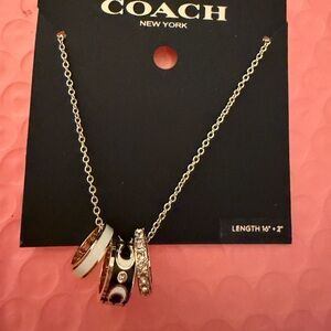 COACH gold Necklace with Black, White and Crystal Accent Rings